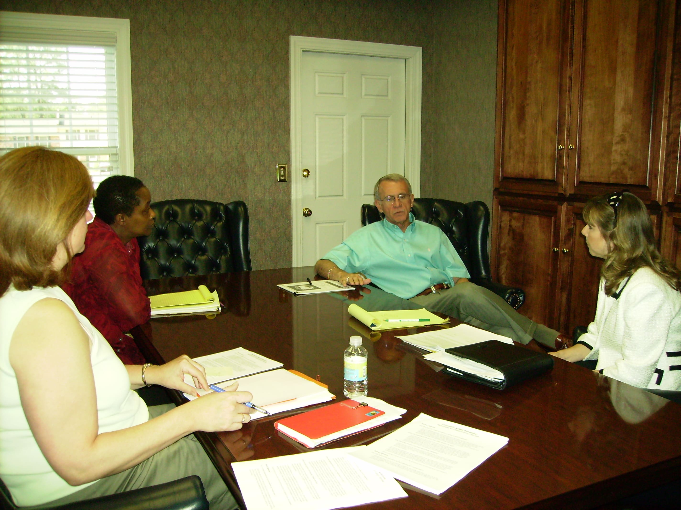 A group of people sitting at a table.